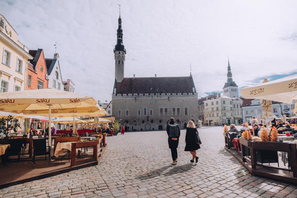 People walking towards the town hall at Town Hall Square in Tallinn, Estonia