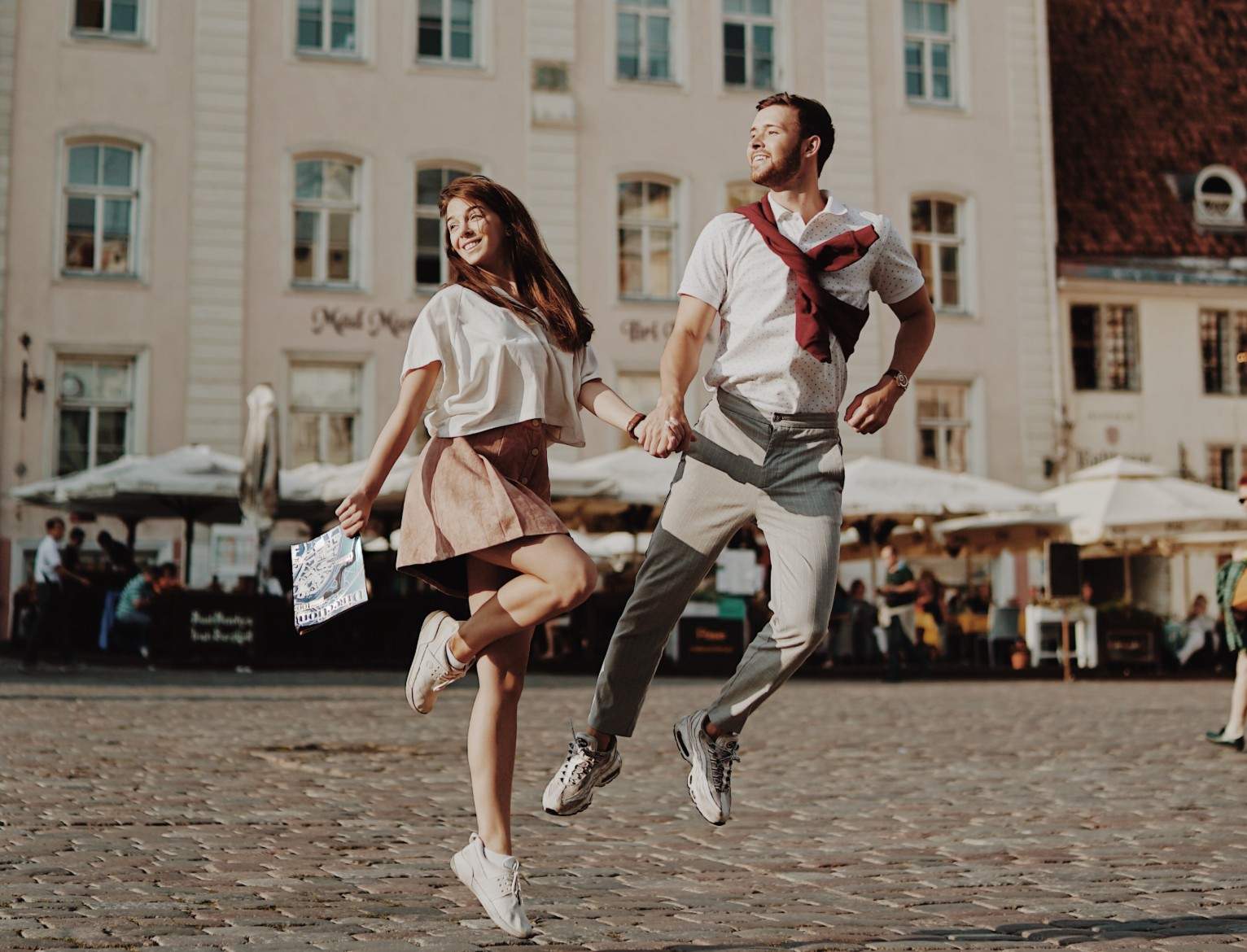 Couple enjoying summer in the Old Town of Tallinn, Estonia Photo: Alexandr Snitovskii