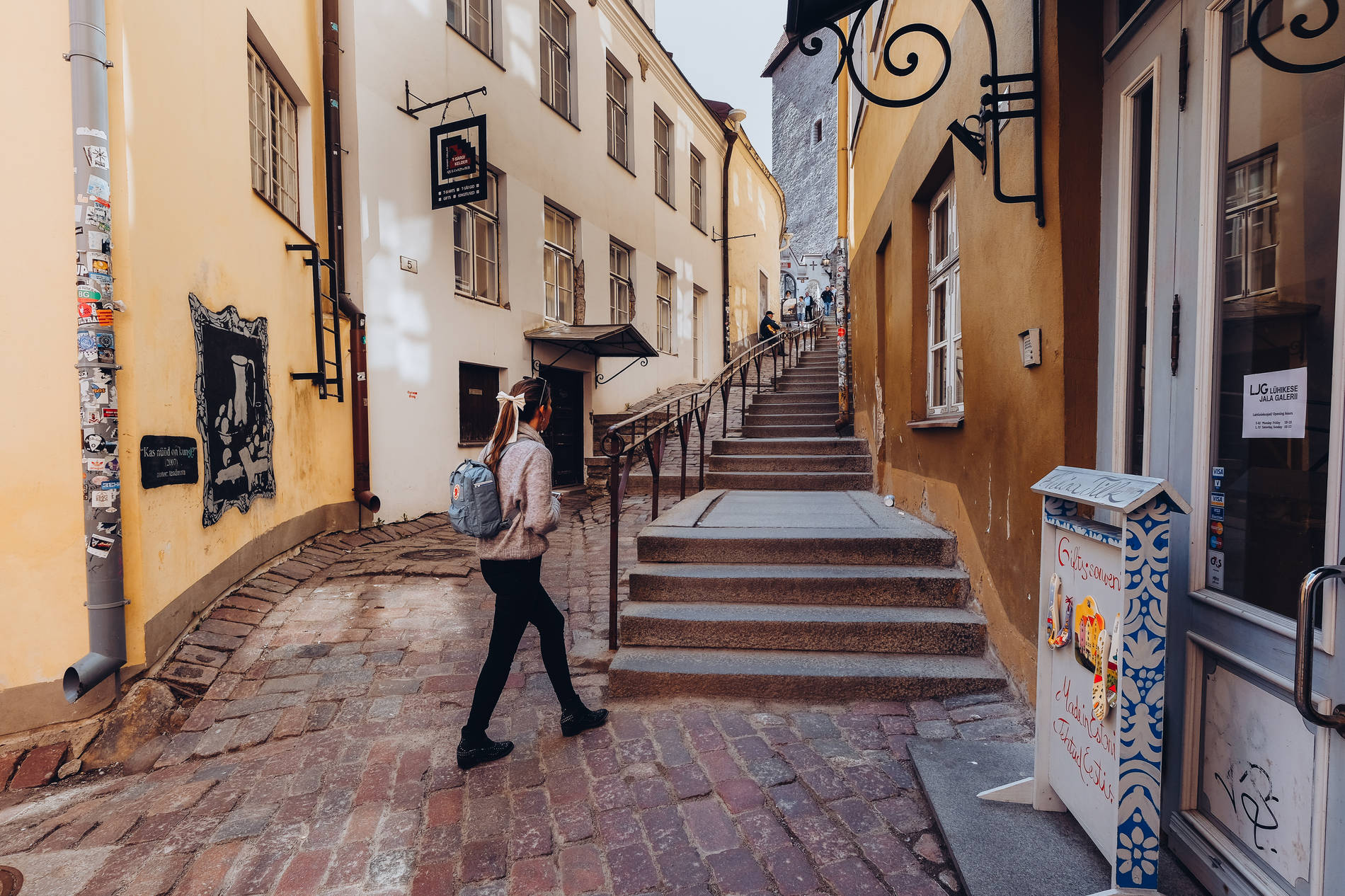 A woman on a romantic street in the medieval Old Town of Tallinn, Estonia Photo: Kadi-Liis Koppel